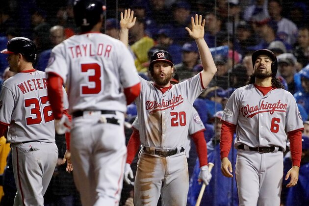 CHICAGO, IL - OCTOBER 11:  Matt Wieters #32, Daniel Murphy #20 and Anthony Rendon #6 of the Washington Nationals wait for Michael Taylor #3 after Taylor hit a grand slam in the eighth inning during game four of the National League Division Series against the Chicago Cubs at Wrigley Field on October 11, 2017 in Chicago, Illinois. (Photo by Jonathan Daniel/Getty Images)