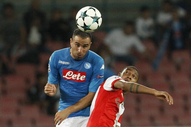 Feyenoord's Dutch striker Jean-Paul Boetius (R) fights for the ball with Napoli's midfielder from Serbia Nikola Maksimovic during the UEFA Champion's League Group F football match Napoli vs Feyenoord Rotterdam on September 26, 2017 at the San Paolo stadium in Naples.  / AFP PHOTO / Carlo Hermann        (Photo credit should read CARLO HERMANN/AFP/Getty Images)
