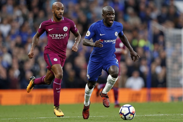 Chelsea's French midfielder N'Golo Kante (R) runs away from Manchester City's English midfielder Fabian Delph during the English Premier League football match between Chelsea and Manchester City at Stamford Bridge in London on September 30, 2017. / AFP PHOTO / Adrian DENNIS / RESTRICTED TO EDITORIAL USE. No use with unauthorized audio, video, data, fixture lists, club/league logos or 'live' services. Online in-match use limited to 75 images, no video emulation. No use in betting, games or single club/league/player publications.  /         (Photo credit should read ADRIAN DENNIS/AFP/Getty Images)