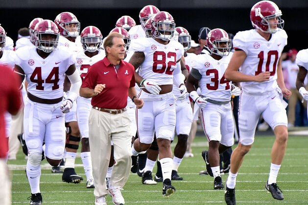 NASHVILLE, TN - SEPTEMBER 23:  Head coach Nick Saban of the Alabama Crimson Tide runs onto the field with his team prior to a game against the Vanderbilt Commodores during the first half at Vanderbilt Stadium on September 23, 2017 in Nashville, Tennessee.  (Photo by Frederick Breedon/Getty Images)