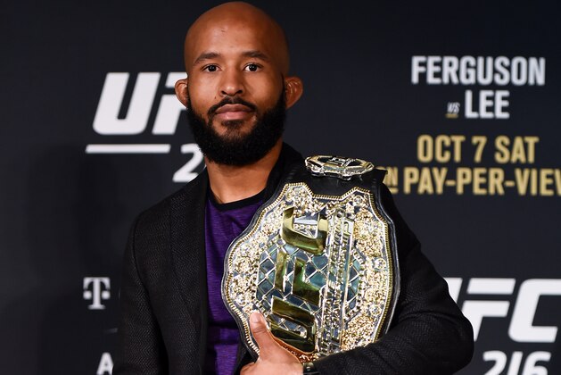 LAS VEGAS, NV - OCTOBER 07: UFC featherweight champion Demetrious Johnson poses for a picture during the UFC 216 event inside TMobile Arena on October 7, 2017 in Las Vegas, Nevada. (Photo by Brandon Magnus/Zuffa LLC/Zuffa LLC via Getty Images) LAS VEGAS, NV - OCTOBER 07: UFC featherweight champion Demetrious Johnson poses for a picture during the UFC 216 event inside TMobile Arena on October 7, 2017 in Las Vegas, Nevada. (Photo by Brandon Magnus/Zuffa LLC/Zuffa LLC via Getty Images)