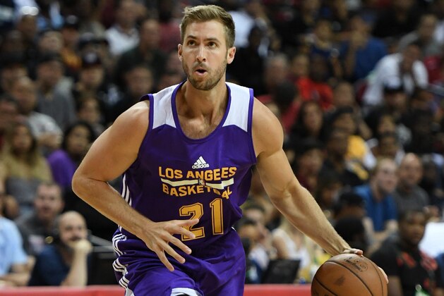 LAS VEGAS, NV - JULY 13:  Travis Wear #21 of the Los Angeles Lakers brings the ball up the court against the Cleveland Cavaliers during the 2017 Summer League at the Thomas & Mack Center on July 13, 2017 in Las Vegas, Nevada. Los Angeles won 94-83. NOTE TO USER: User expressly acknowledges and agrees that, by downloading and or using this photograph, User is consenting to the terms and conditions of the Getty Images License Agreement.  (Photo by Ethan Miller/Getty Images)