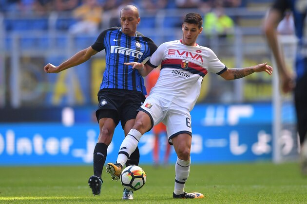 Inter Milan's Brazilian defender  Miranda (L)vies with Genoa's Italian forward Pietro Pellegri during the Italian Serie A football match Inter Milan vs Genoa at the San Siro stadium in Milan on September 24,  2017.    / AFP PHOTO / MARCO BERTORELLO        (Photo credit should read MARCO BERTORELLO/AFP/Getty Images)