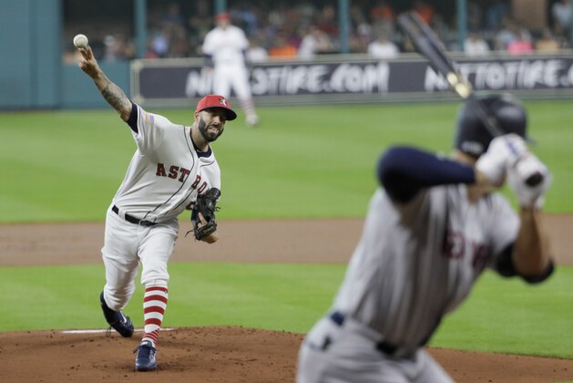 Houston Astros starting pitcher Mike Fiers, left, throws to New York Yankees' Aaron Judge during the first inning of a baseball game Sunday, July 2, 2017, in Houston. (AP Photo/David J. Phillip)