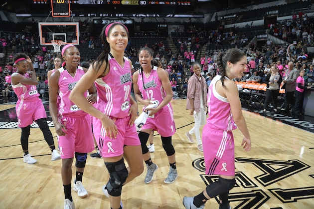 SAN ANTONIO, TX - AUGUST 5:  Isabelle Harrison #20, Shay Murphy #7, Nia Coffey #12 and Kelsey Plum #10 of the San Antonio Stars celebrate a win against the Seattle Storm on August 5, 2017 at the AT&T Center in San Antonio, Texas. NOTE TO USER: User expressly acknowledges and agrees that, by downloading and or using this photograph, user is consenting to the terms and conditions of the Getty Images License Agreement. Mandatory Copyright Notice: Copyright 2017 NBAE (Photos by Mark Sobhani/NBAE via Getty Images)