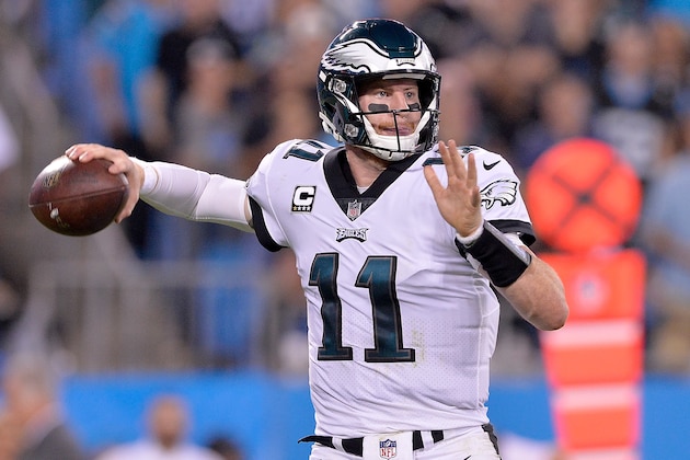 CHARLOTTE, NC - OCTOBER 12:  Carson Wentz #11 of the Philadelphia Eagles looks to pass against the Carolina Panthers during their game at Bank of America Stadium on October 12, 2017 in Charlotte, North Carolina.  (Photo by Grant Halverson/Getty Images)