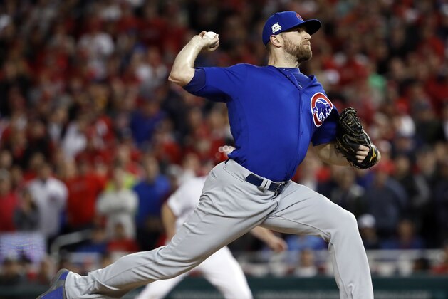 Chicago Cubs relief pitcher Wade Davis throws during the eighth inning in Game 5 of baseball's National League Division Series against the Washington Nationals, at Nationals Park, early Friday, Oct. 13, 2017, in Washington.  (AP Photo/Pablo Martinez Monsivais)