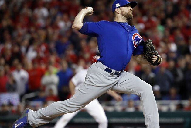 Chicago Cubs relief pitcher Wade Davis throws during the eighth inning in Game 5 of baseball's National League Division Series against the Washington Nationals, at Nationals Park, early Friday, Oct. 13, 2017, in Washington.  (AP Photo/Pablo Martinez Monsivais)