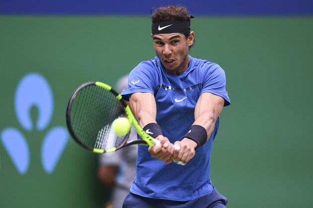 SHANGHAI, CHINA - OCTOBER 13:  Rafael Nadal of Spain returns a shot during Men's singles quarter final mach against Grigor Dimitrov of Bulgaria on day six of 2017 ATP Shanghai Rolex Masters at Qizhong Stadium on October 13, 2017 in Shanghai, China.  (Photo by XIN LI/Getty Images)
