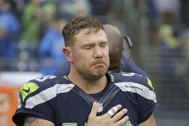 Seattle Seahawks' Nate Boyer closes his eyes during the national anthem before a preseason NFL football game against the Denver Broncos, Friday, Aug. 14, 2015, in Seattle. (AP Photo/Elaine Thompson)