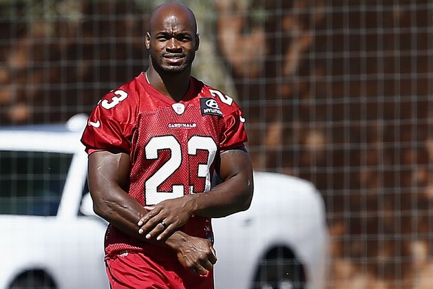 New Arizona Cardinals running back Adrian Peterson walks to a practice field during practice at the NFL football team's training facility Wednesday, Oct. 11, 2017, in Tempe, Ariz. (AP Photo/Ross D. Franklin)
