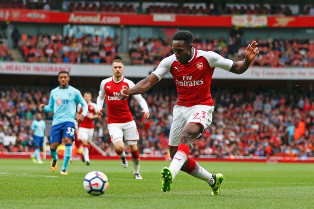 Arsenal's English striker Danny Welbeck shoots to score his second and his team's third goal during the English Premier League football match between Arsenal and Bournemouth at the Emirates Stadium in London on September 9, 2017. / AFP PHOTO / Ian KINGTON / RESTRICTED TO EDITORIAL USE. No use with unauthorized audio, video, data, fixture lists, club/league logos or 'live' services. Online in-match use limited to 75 images, no video emulation. No use in betting, games or single club/league/player publications.  /         (Photo credit should read IAN KINGTON/AFP/Getty Images)