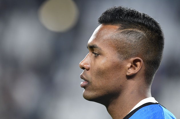 Juventus' defender from Brazil Alex Sandro warms up before the UEFA Champion's League Group D football match Juventus vs Olympiacos on September 27, 2017 at the Juventus stadium in Turin.  / AFP PHOTO / Miguel MEDINA        (Photo credit should read MIGUEL MEDINA/AFP/Getty Images)