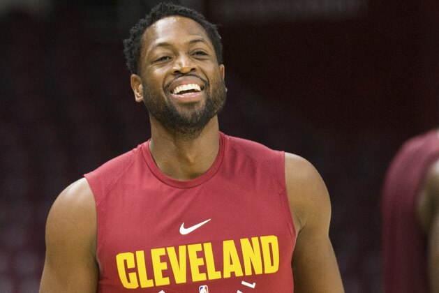 Cleveland Cavaliers' Dwyane Wade laughs during warmups prior to an NBA preseason basketball game against the Indiana Pacers, Friday, Oct. 6, 2017, in Cleveland. (AP Photo/Scott R. Galvin)