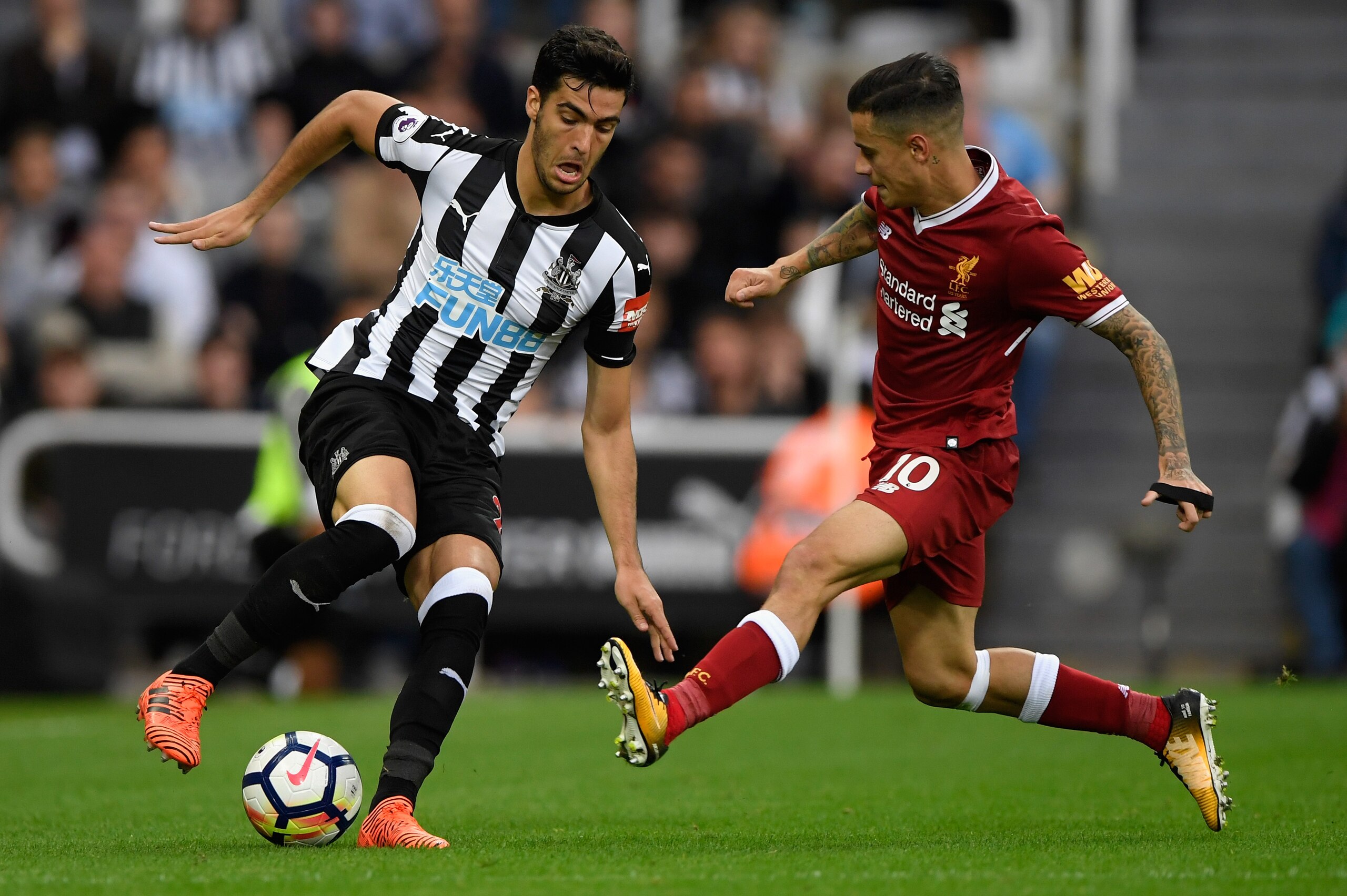 NEWCASTLE UPON TYNE, ENGLAND - OCTOBER 01: Newcastle player Mikel Merino (l) is challenged by Phillipe Coutinho of Liverpool during the Premier League match between Newcastle United and Liverpool at St. James Park on October 1, 2017 in Newcastle upon Tyne, England. (Photo by Stu Forster/Getty Images) NEWCASTLE UPON TYNE, ENGLAND - OCTOBER 01: Newcastle player Mikel Merino (l) is challenged by Phillipe Coutinho of Liverpool during the Premier League match between Newcastle United and Liverpool at St. James Park on October 1, 2017 in Newcastle upon Tyne, England. (Photo by Stu Forster/Getty Images)