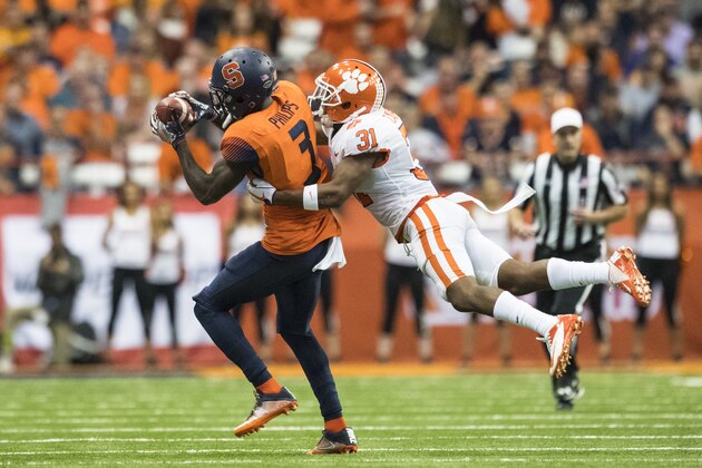 SYRACUSE, NY - OCTOBER 13:  Ervin Philips #3 of the Syracuse Orange makes a first down reception during the second quarter as he is tackled by Ryan Carter #31 of the Clemson Tigers at the Carrier Dome on October 13, 2017 in Syracuse, New York.  (Photo by Brett Carlsen/Getty Images)