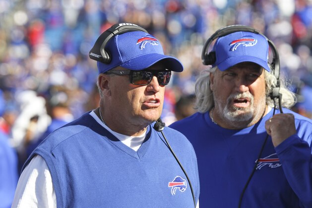 Buffalo Bills head coach Rex Ryan, left, and coach Rob Ryan work on the sidelines during the second half of an NFL football game against the Arizona Cardinals on Sunday, Sept. 25, 2016, in Orchard Park, N.Y. Buffalo won 33-18. (AP Photo/Jeffrey T. Barnes)