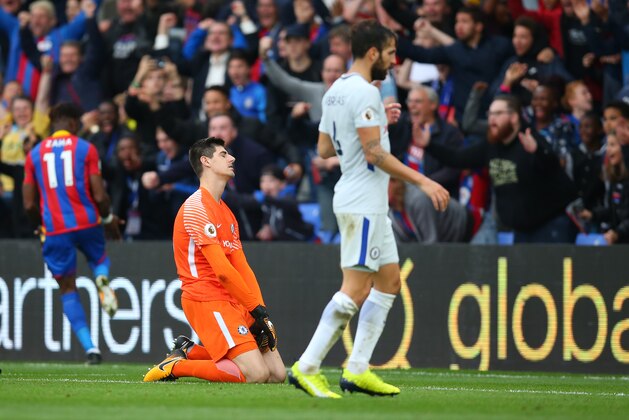 LONDON, ENGLAND - OCTOBER 14: A dejected looking Chelsea goalkeeper Thibaut Courtois  after Wilfried Zaha of Crystal Palace scores a goal to make it 2-1 during the Premier League match between Crystal Palace and Chelsea at Selhurst Park on October 14, 2017 in London, England. (Photo by Catherine Ivill - AMA/Getty Images)