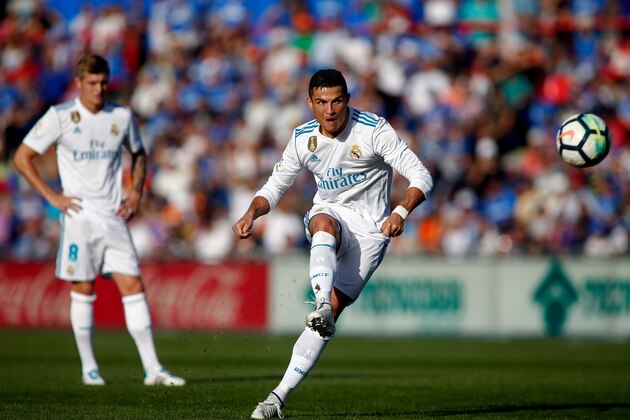 Real Madrid's Portuguese forward Cristiano Ronaldo kicks the ball during the Spanish league football match Getafe CF vs Real Madrid at the Coliseum Alfonso Perez stadium in Getafe on October 14, 2017. / AFP PHOTO / OSCAR DEL POZO        (Photo credit should read OSCAR DEL POZO/AFP/Getty Images)