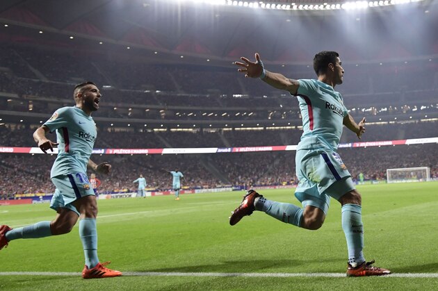 Barcelona's Uruguayan forward Luis Suarez (R) celebrates a goal during the Spanish league football match Club Atletico de Madrid vs FC Barcelona at the Wanda Metropolitano stadium in Madrid on October 14, 2017. / AFP PHOTO / JAVIER SORIANO (Photo credit should read JAVIER SORIANO/AFP/Getty Images) Barcelona's Uruguayan forward Luis Suarez (R) celebrates a goal during the Spanish league football match Club Atletico de Madrid vs FC Barcelona at the Wanda Metropolitano stadium in Madrid on October 14, 2017. / AFP PHOTO / JAVIER SORIANO (Photo credit should read JAVIER SORIANO/AFP/Getty Images)