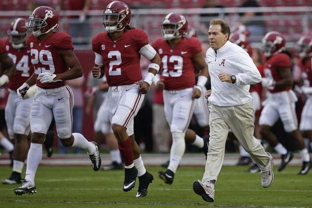 Alabama coach Nick Saban runs onto the field before the team's NCAA college football game against Arkansas, Saturday, Oct. 14, 2017, in Tuscaloosa, Ala. (AP Photo/Brynn Anderson)
