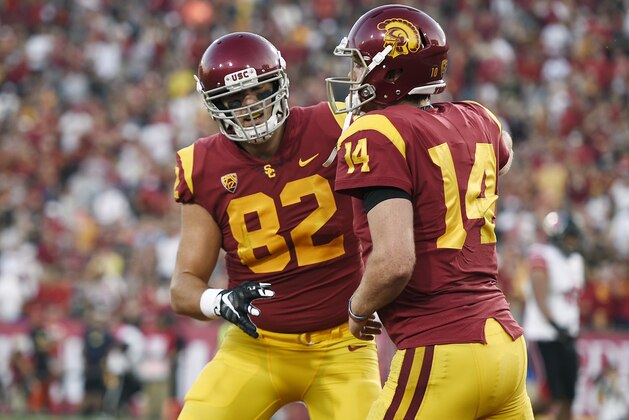Southern California quarterback Sam Darnold, right, celebrate with tight end Tyler Petite after a touchdown catch by Petite during the first half of an NCAA college football game against Utah in Los Angeles, Saturday, Oct. 14, 2017. (AP Photo/Kelvin Kuo)