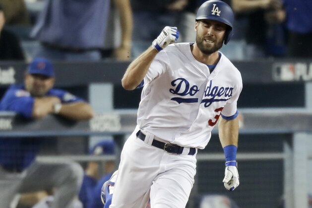 Los Angeles Dodgers' Chris Taylor celebrates his home run against the Chicago Cubs during the sixth inning of Game 1 of baseball's National League Championship Series in Los Angeles, Saturday, Oct. 14, 2017. (AP Photo/Alex Gallardo)