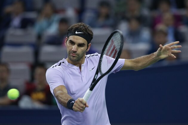 SHANGHAI, CHINA - OCTOBER 14:  Roger Federer of Switzerland returns a shot during the Men's singles Semifinal mach against Juan Martin del Potro of Argentina on day seven of 2017 ATP Shanghai Rolex Masters at Qizhong Stadium on October 14, 2017 in Shanghai, China.  (Photo by Lintao Zhang/Getty Images)