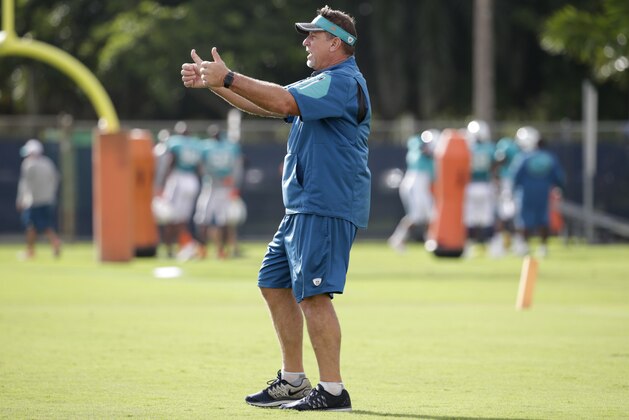 Miami Dolphins offensive line coach Chris Foerster watches as players do drills, Tuesday, Aug. 16, 2016, during practice at NFL football training camp in Davie, Fla. (AP Photo/Lynne Sladky)