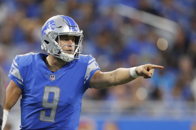 Detroit Lions quarterback Matthew Stafford (9) points against the Carolina Panthers during an NFL football game in Detroit, Sunday, Oct. 8, 2017. (AP Photo/Paul Sancya)