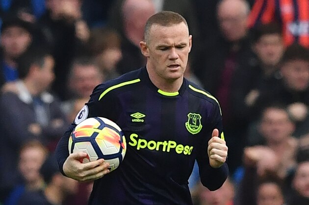 Everton's English striker Wayne Rooney celebrates scoring a penalty during the English Premier League football match between Brighton and Hove Albion and Everton at the American Express Community Stadium in Brighton, southern England on October 15, 2017. / AFP PHOTO / Ben STANSALL / RESTRICTED TO EDITORIAL USE. No use with unauthorized audio, video, data, fixture lists, club/league logos or 'live' services. Online in-match use limited to 75 images, no video emulation. No use in betting, games or single club/league/player publications.  /         (Photo credit should read BEN STANSALL/AFP/Getty Images)