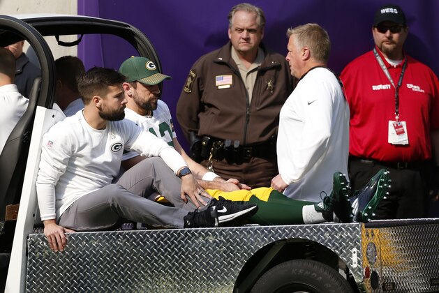 Green Bay Packers quarterback Aaron Rodgers (12) rides a cart to the locker room after being injured against the Minnesota Vikings in the first half of an NFL football game in Minneapolis, Sunday, Oct. 15, 2017. (AP Photo/Bruce Kluckhohn)