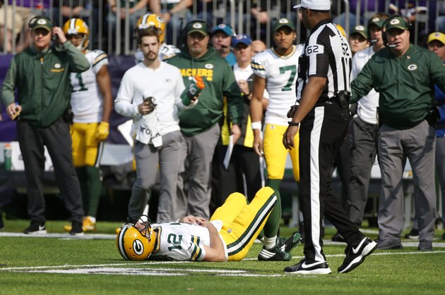 Green Bay Packers quarterback Aaron Rodgers (12) lies on the ground after being hit by Minnesota Vikings outside linebacker Anthony Barr (55) in the first half of an NFL football game in Minneapolis, Sunday, Oct. 15, 2017. (AP Photo/Bruce Kluckhohn) Green Bay Packers quarterback Aaron Rodgers (12) lies on the ground after being hit by Minnesota Vikings outside linebacker Anthony Barr (55) in the first half of an NFL football game in Minneapolis, Sunday, Oct. 15, 2017. (AP Photo/Bruce Kluckhohn)