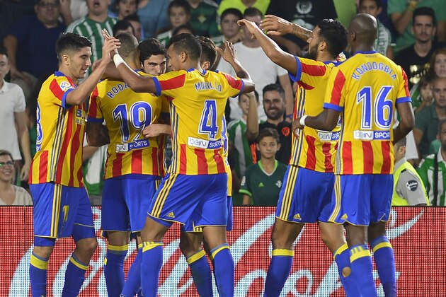 Valencia's Portuguese forward Goncalo Guedes (2L) celebrates after scoring a goal during the Spanish league football match Real Betis FC vs Valencia FC at the Benito Villamarin stadium in Sevilla on October 15, 2017. / AFP PHOTO / CRISTINA QUICLER        (Photo credit should read CRISTINA QUICLER/AFP/Getty Images)