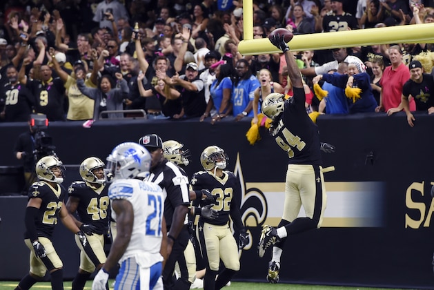 New Orleans Saints defensive end Cameron Jordan (94) celebrates his touchdown after interception in the end zone in the second half of an NFL football game against the Detroit Lions in New Orleans, Sunday, Oct. 15, 2017. (AP Photo/Bill Feig)