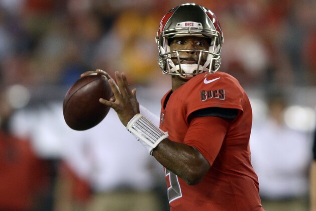 Tampa Bay Buccaneers quarterback Jameis Winston looks for a receiver during the second half of an NFL football game against the New England Patriots, Thursday, Oct. 5, 2017, in Tampa, Fla. (AP Photo/Jason Behnken)