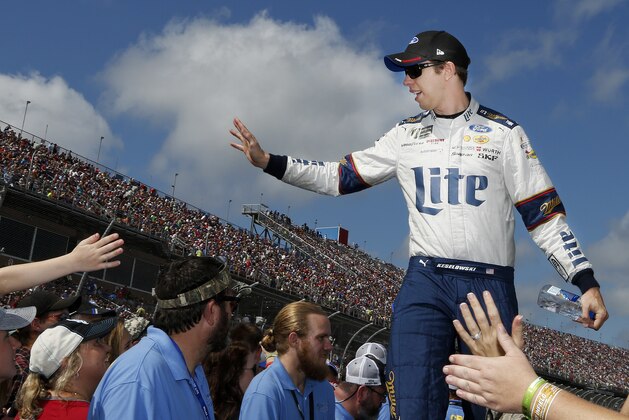 NASCAR driver Brad Keselowski (2) waves to racing fans during NASCAR Talladega auto race driver introductions at Talladega Superspeedway, Sunday, Oct. 15, 2017, in Talladega, Ala. (AP Photo/Brynn Anderson)