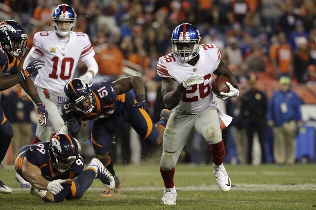 New York Giants running back Orleans Darkwa (26) runs with the ball during the second half of an NFL football game against the Denver Broncos Sunday, Oct. 15, 2017, in Denver. (AP Photo/Joe Mahoney)