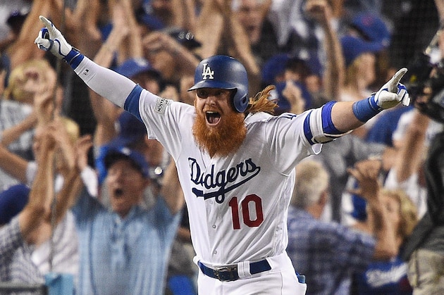 LOS ANGELES, CA - OCTOBER 15:  Justin Turner #10 of the Los Angeles Dodgers celebrates after hitting a three-run walk-off home run in the ninth inning to defeat the Chicago Cubs 4-1 in game two of the National League Championship Series at Dodger Stadium on October 15, 2017 in Los Angeles, California.  (Photo by Kevork Djansezian/Getty Images)