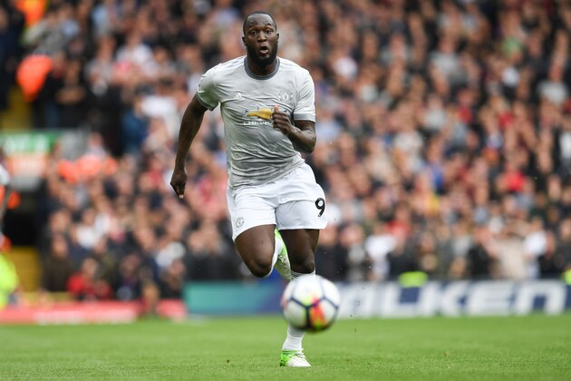 Manchester United's Belgian striker Romelu Lukaku chases the ball during the English Premier League football match between Liverpool and Manchester United at Anfield in Liverpool, north west England on October 14, 2017. / AFP PHOTO / Paul ELLIS / RESTRICTED TO EDITORIAL USE. No use with unauthorized audio, video, data, fixture lists, club/league logos or 'live' services. Online in-match use limited to 75 images, no video emulation. No use in betting, games or single club/league/player publications.  /         (Photo credit should read PAUL ELLIS/AFP/Getty Images)