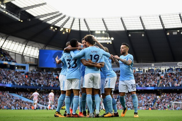 MANCHESTER, ENGLAND - OCTOBER 14:  Raheem Sterling of Manchester City celebrates scoring his sides second goal with Gabriel Jesus of Manchester City and his team mates during the Premier League match between Manchester City and Stoke City at Etihad Stadium on October 14, 2017 in Manchester, England.  (Photo by Laurence Griffiths/Getty Images)