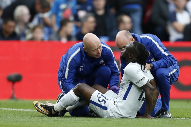 Chelsea's Nigerian midfielder Victor Moses receives treatment for an injury during the English Premier League football match between Crystal Palace and Chelsea at Selhurst Park in south London on October 14, 2017 / AFP PHOTO / Ian KINGTON / RESTRICTED TO EDITORIAL USE. No use with unauthorized audio, video, data, fixture lists, club/league logos or 'live' services. Online in-match use limited to 75 images, no video emulation. No use in betting, games or single club/league/player publications.  /         (Photo credit should read IAN KINGTON/AFP/Getty Images)