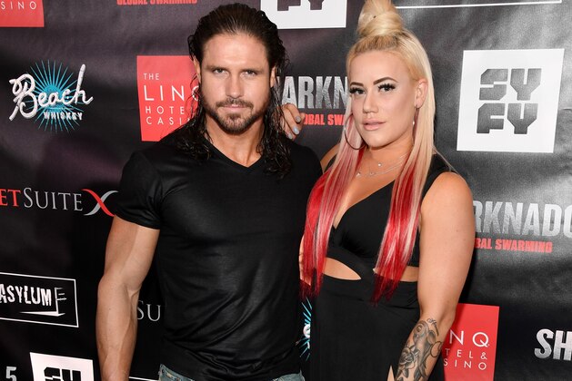 LAS VEGAS, NV - AUGUST 06: Professional wrestler and actor John Hennigan (L) and his fiancee, professional wrestler Kira Forster, attend the premiere of 'Sharknado 5: Global Swarming' at The LINQ Hotel & Casino on August 6, 2017 in Las Vegas, Nevada. (Photo by Ethan Miller/Getty Images for Caesars Entertainment) LAS VEGAS, NV - AUGUST 06: Professional wrestler and actor John Hennigan (L) and his fiancee, professional wrestler Kira Forster, attend the premiere of 'Sharknado 5: Global Swarming' at The LINQ Hotel & Casino on August 6, 2017 in Las Vegas, Nevada. (Photo by Ethan Miller/Getty Images for Caesars Entertainment)