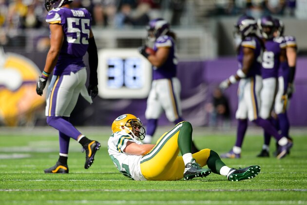 MINNEAPOLIS, MN - OCTOBER 15: Aaron Rodgers #12 of the Green Bay Packers lays on the field as Anthony Barr #55 of the Minnesota Vikings walks away during the game on October 15, 2017 at US Bank Stadium in Minneapolis, Minnesota. (Photo by Hannah Foslien/Getty Images)
