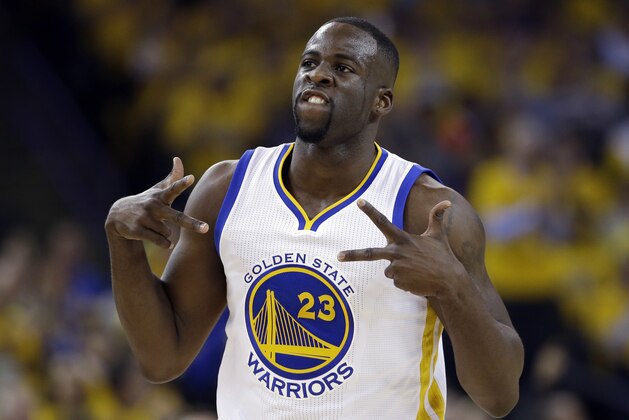 FILE - In this April 27, 2016, file photo, Golden State Warriors' Draymond Green celebrates after scoring against the Houston Rockets during the first half in Game 5 of a first-round NBA basketball playoff series, in Oakland, Calif.  A court conference is scheduled for Golden State Warriors star Draymond Green in his misdemeanor assault and battery case before he leaves next month for the Olympics. The former Michigan State basketball player is accused of striking former Spartans football player Jermaine Edmondson in the jaw during a weekend confrontation near the East Lansing campus. (AP Photo/Marcio Jose Sanchez, File)