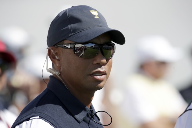 Tiger Woods looks on before the first round of the Presidents Cup at Liberty National Golf Club in Jersey City, N.J., Thursday, Sept. 28, 2017. (AP Photo/Julio Cortez)