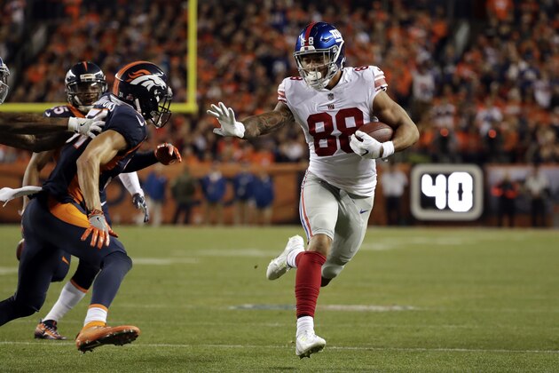 New York Giants tight end Evan Engram (88) runs upfield during the first half of an NFL football game against the Denver Broncos, Sunday, Oct. 15, 2017, in Denver. (AP Photo/Jack Dempsey)
