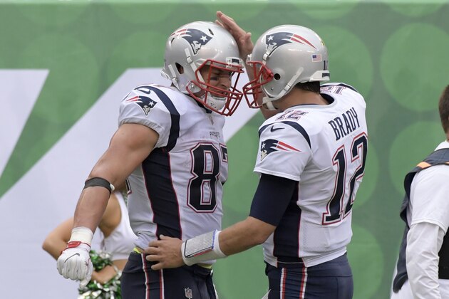 New England Patriots tight end Rob Gronkowski (87) celebrates with Tom Brady (12) after the two connected for a touchdown during the second half of an NFL football game against the New York Jets Sunday, Oct. 15, 2017, in East Rutherford, N.J. (AP Photo/Bill Kostroun)