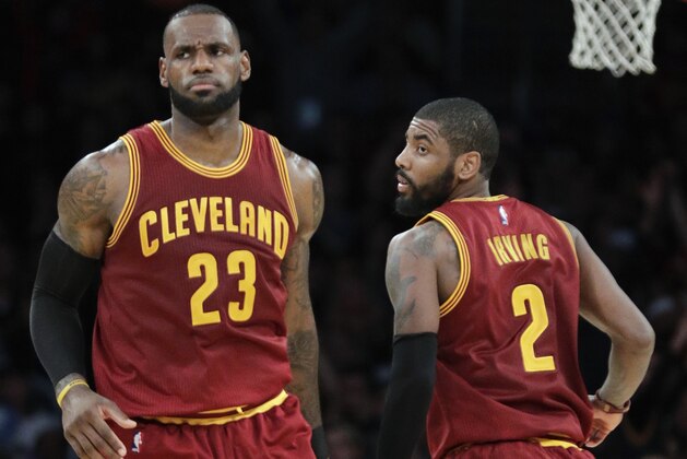 FILE - In this March 19, 2017, file photo, Cleveland Cavaliers' LeBron James, left, greets Kyrie Irving during the second half of an NBA basketball game against the Los Angeles Lakers in Los Angeles. There is bad blood once again in the NBA. No, it’s not just the Pistons-Bulls or Celtics-Lakers type of feuds. Sure, there’s Warriors-Cavs, Thunder-Warriors and Cavs-Celtics. But these days, it’s more individually driven _ thanks in large part to social media.  There’s Russ-KD, LeBron-Kyrie, and even a Whiteside-Embiid can get in on the action. The back-and-forth makes for matchups worth circling on the calendar _ beginning Tuesday night with Boston-Cleveland.  (AP Photo/Jae C. Hong, File)
