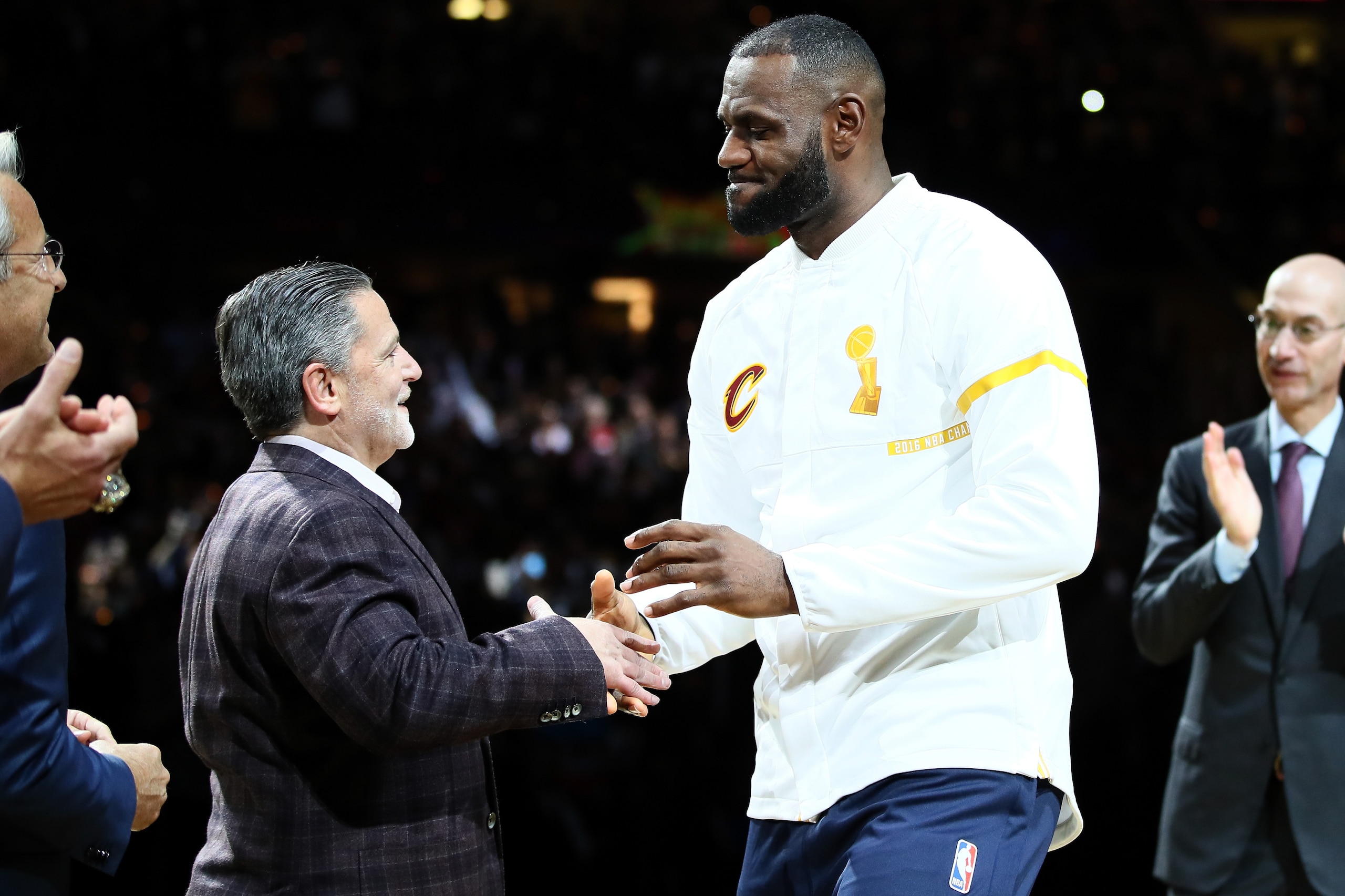 CLEVELAND, OH - OCTOBER 25: LeBron James #23 of the Cleveland Cavaliers recieves his championship ring from owner Dan Gilbert before the game against the New York Knicks at Quicken Loans Arena on October 25, 2016 in Cleveland, Ohio.   NOTE TO USER: User expressly acknowledges and agrees that, by downloading and or using this photograph, User is consenting to the terms and conditions of the Getty Images License Agreement. (Photo by Ezra Shaw/Getty Images)
